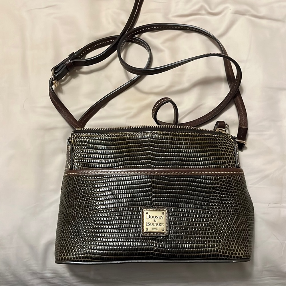 Dooney and Burke crossbody purse. Red interior. Snake skin print